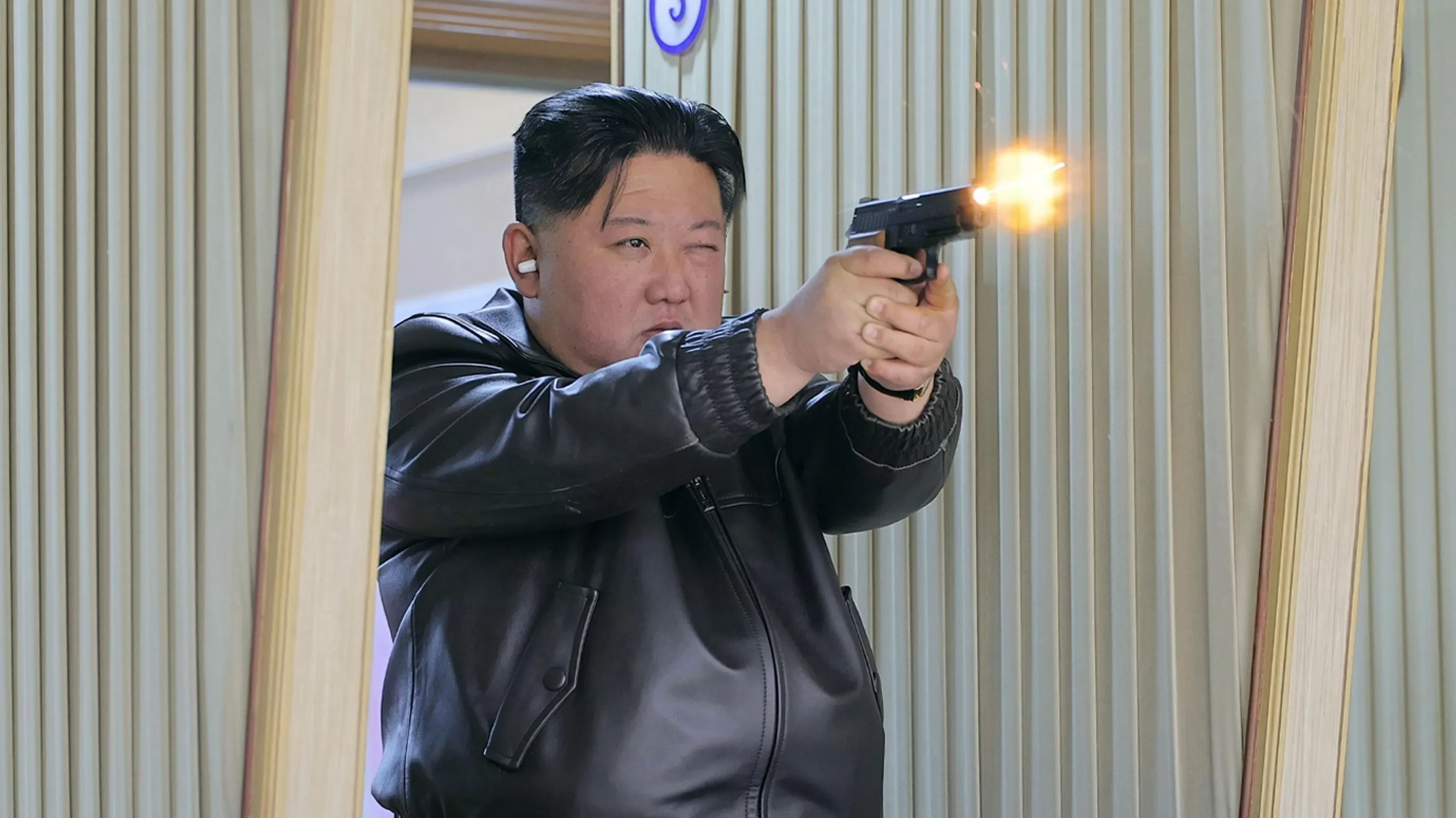 North Korean leader Kim and his daughter try out new pistols at shooting range