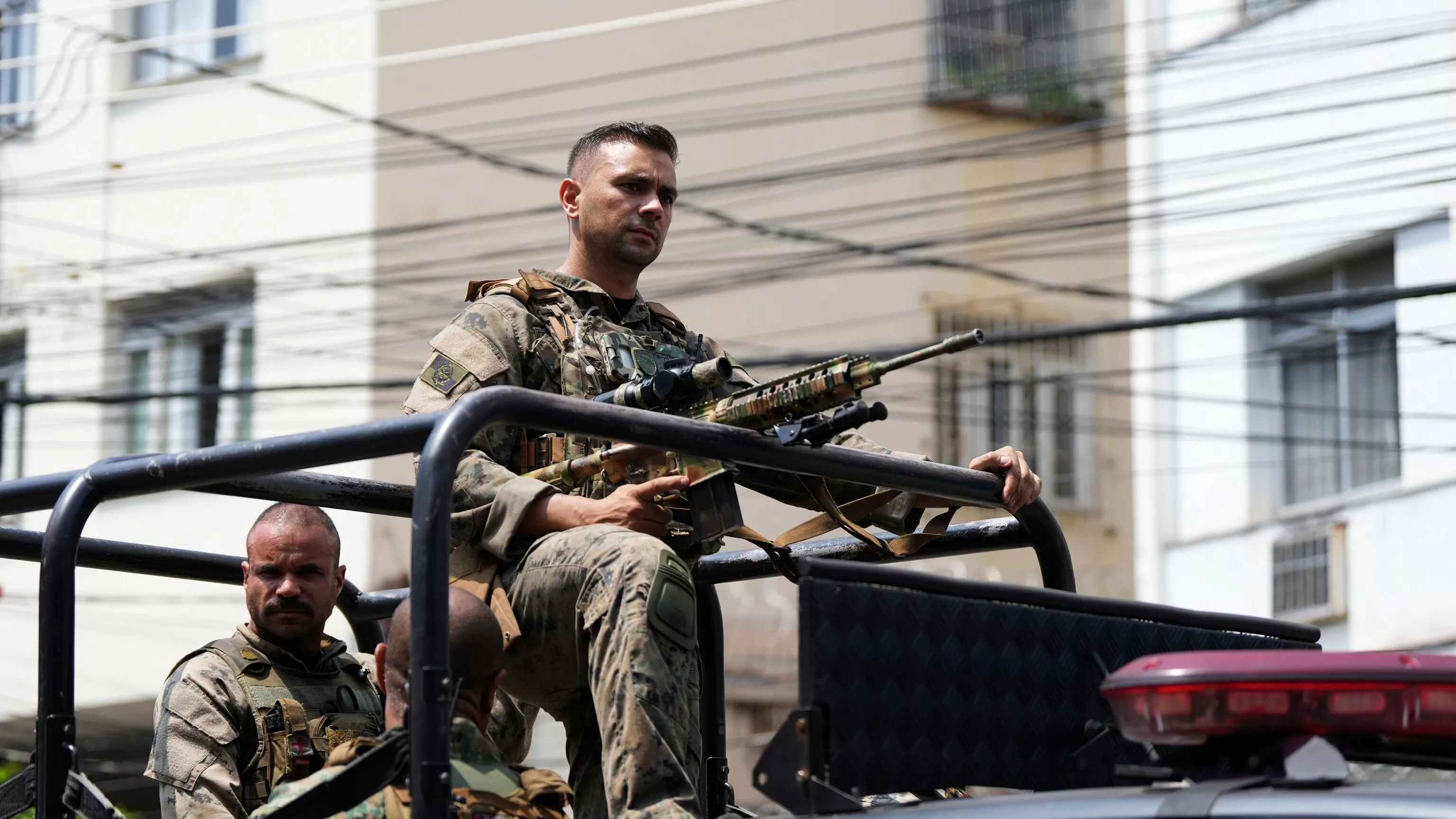 Rio police pull 4 officers from street duty in a probe into a deadly raid