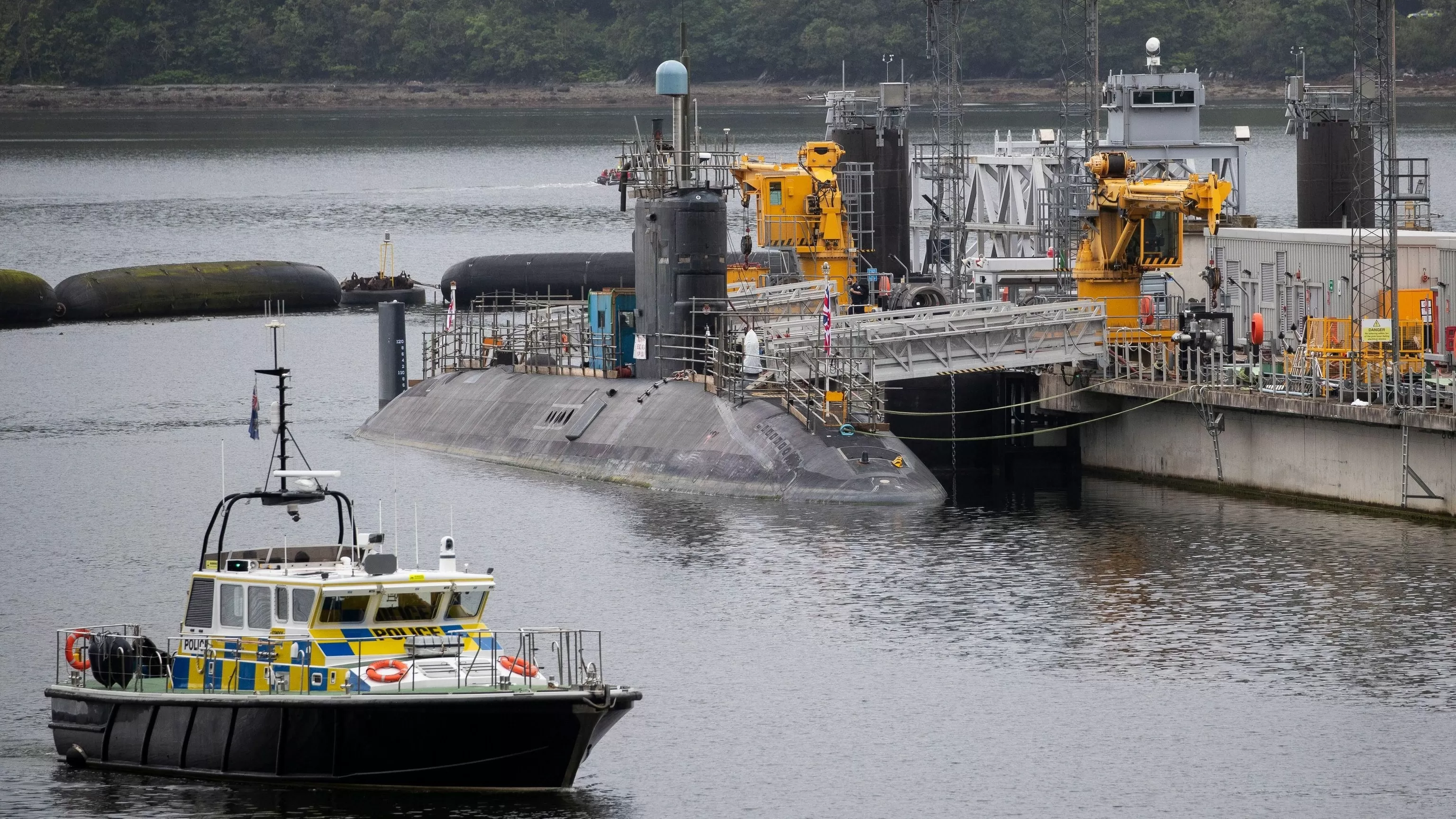 Iranian and Romanian charged after trying to enter UK's nuclear submarine base